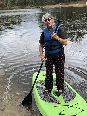 Ann on a paddle board.